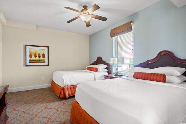 8121 Amalfi Pl Unit 7-604, Myrtle Beach, SC 29572 - carpeted bedroom featuring baseboards and a ceiling fan