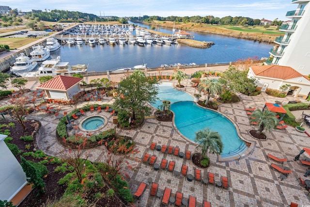 8121 Amalfi Pl Unit 7-604, Myrtle Beach, SC 29572 - drone / aerial view of a pool area and a large body of water