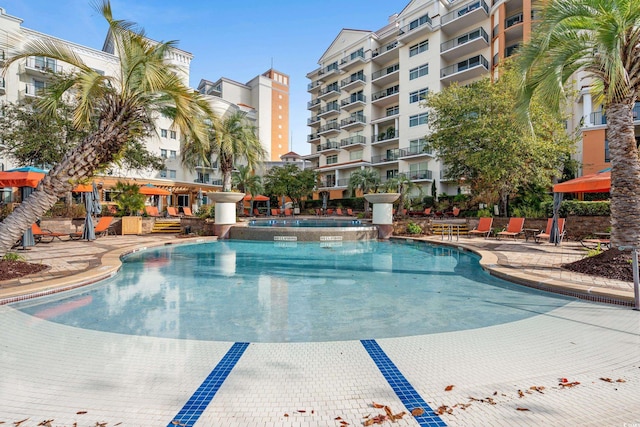 8121 Amalfi Pl Unit 7-604, Myrtle Beach, SC 29572 - community pool featuring a patio area