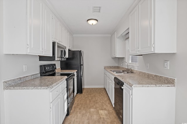 kitchen with black appliances, a sink, white cabinets, baseboards, and crown molding