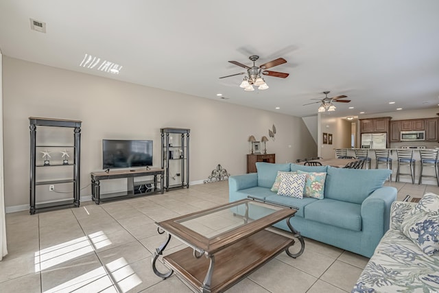 703 37th Ave S, North Myrtle Beach, SC 29582 - living room with light tile patterned flooring, a ceiling fan, recessed lighting, and baseboards