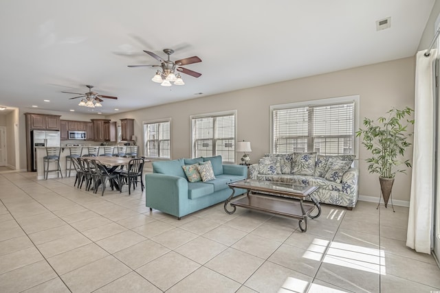 703 37th Ave S, North Myrtle Beach, SC 29582 - living area with a ceiling fan, healthy amount of natural light, light tile patterned floors, recessed lighting, and baseboards