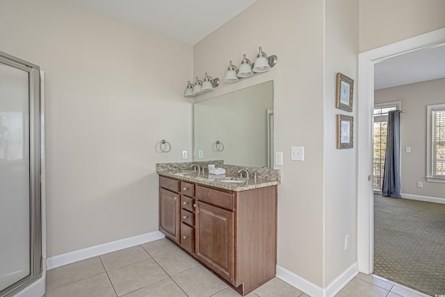 703 37th Ave S, North Myrtle Beach, SC 29582 - bathroom with double vanity, tile patterned floors, and baseboards