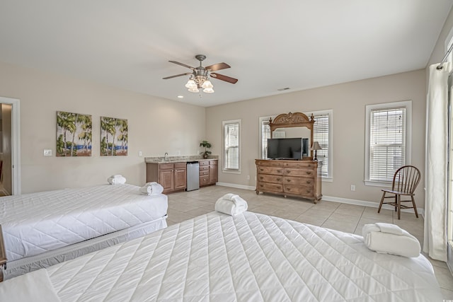 703 37th Ave S, North Myrtle Beach, SC 29582 - bedroom with fridge, light tile patterned flooring, ceiling fan, and baseboards