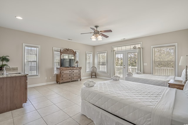 703 37th Ave S, North Myrtle Beach, SC 29582 - bedroom with a sink, french doors, access to exterior, light tile patterned floors, and baseboards