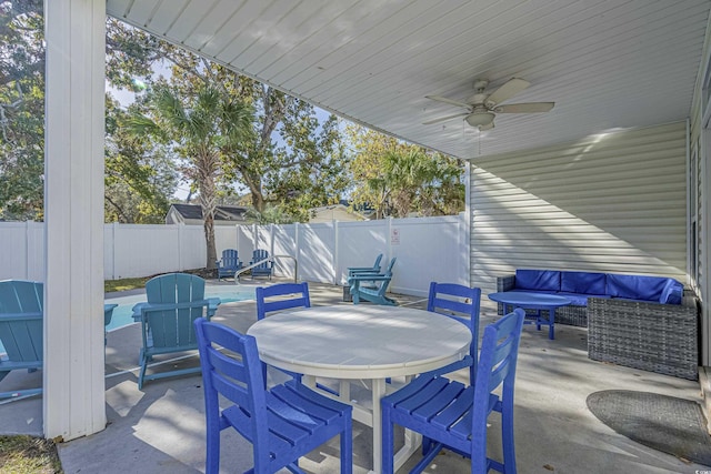 703 37th Ave S, North Myrtle Beach, SC 29582 - fenced backyard with a patio, ceiling fan, outdoor dining area, and outdoor lounge area