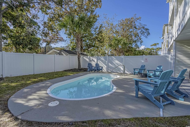 703 37th Ave S, North Myrtle Beach, SC 29582 - view of pool featuring a fenced backyard and a patio