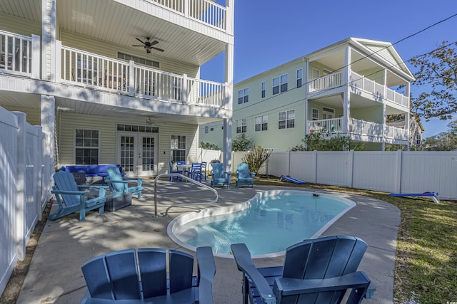 703 37th Ave S, North Myrtle Beach, SC 29582 - view of swimming pool with french doors, a ceiling fan, and a patio area