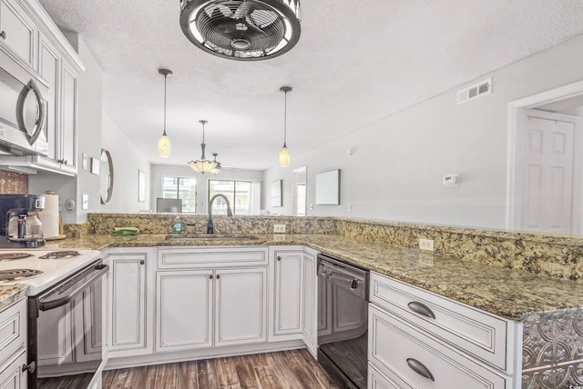 612 N Ocean Blvd Unit 103, Surfside Beach, SC 29575 - kitchen featuring dishwasher, white electric stove, a sink, stainless steel microwave, and wood finished floors