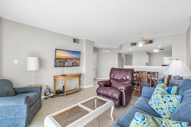 5806 N Ocean Blvd Unit 203, North Myrtle Beach, SC 29582 - living room featuring light tile patterned flooring and baseboards