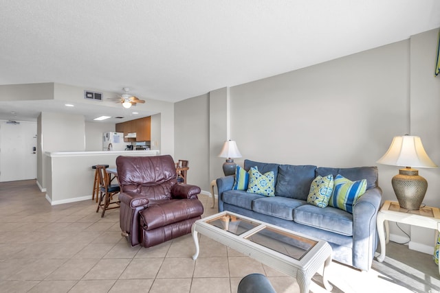 5806 N Ocean Blvd Unit 203, North Myrtle Beach, SC 29582 - living room with baseboards, a ceiling fan, and light tile patterned floors