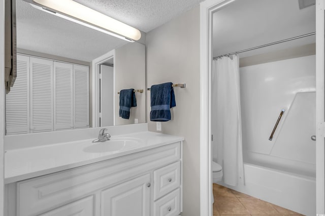 5806 N Ocean Blvd Unit 203, North Myrtle Beach, SC 29582 - bathroom with a textured ceiling, toilet, vanity, tile patterned flooring, and shower / bathtub combination with curtain