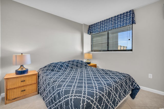 5806 N Ocean Blvd Unit 203, North Myrtle Beach, SC 29582 - bedroom featuring light tile patterned flooring and baseboards
