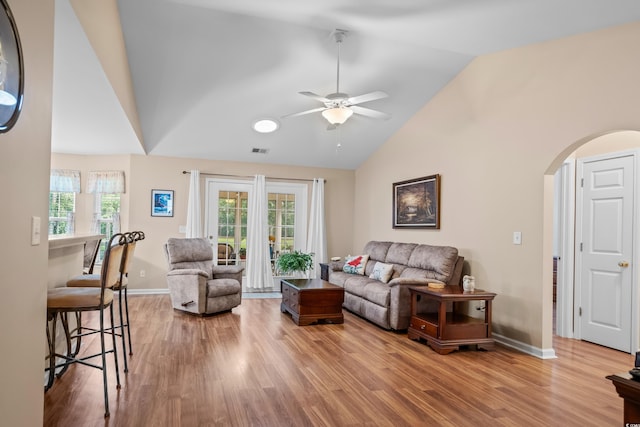 6478 Royal Pine Dr, Myrtle Beach, SC 29588 - living area featuring arched walkways, wood finished floors, a ceiling fan, healthy amount of natural light, and high vaulted ceiling