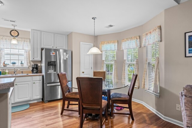 6478 Royal Pine Dr, Myrtle Beach, SC 29588 - dining space with light wood-style flooring and baseboards