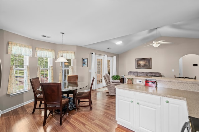 6478 Royal Pine Dr, Myrtle Beach, SC 29588 - dining area with arched walkways, light wood-type flooring, vaulted ceiling, a ceiling fan, and baseboards
