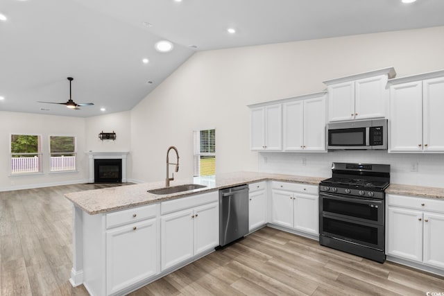 739 Harrison Mill St, Myrtle Beach, SC 29579 - kitchen featuring stainless steel appliances, a sink, a ceiling fan, a peninsula, and white cabinets