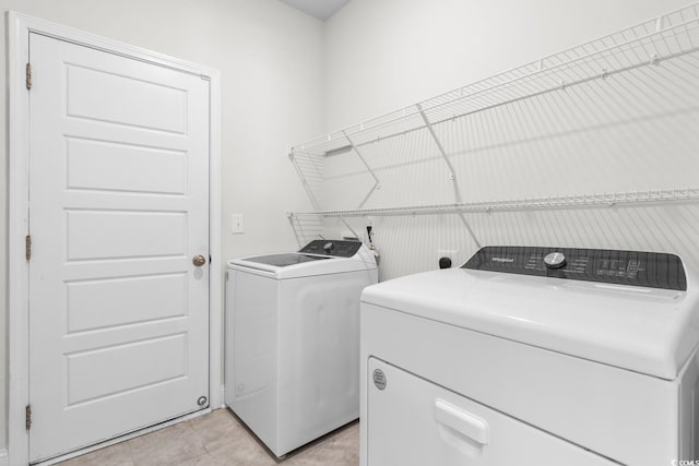 739 Harrison Mill St, Myrtle Beach, SC 29579 - laundry area with independent washer and dryer and light tile patterned floors