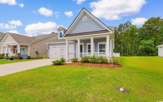 739 Harrison Mill St, Myrtle Beach, SC 29579 - view of front of property featuring covered porch, a garage, concrete driveway, and a front lawn