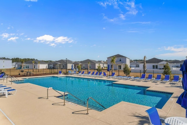739 Harrison Mill St, Myrtle Beach, SC 29579 - community pool featuring a residential view, a patio, and fence