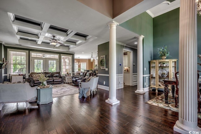 living area with ornate columns, ornamental molding, ceiling fan, coffered ceiling, and beam ceiling