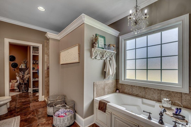 bathroom with a bath, crown molding, baseboards, a chandelier, and toilet
