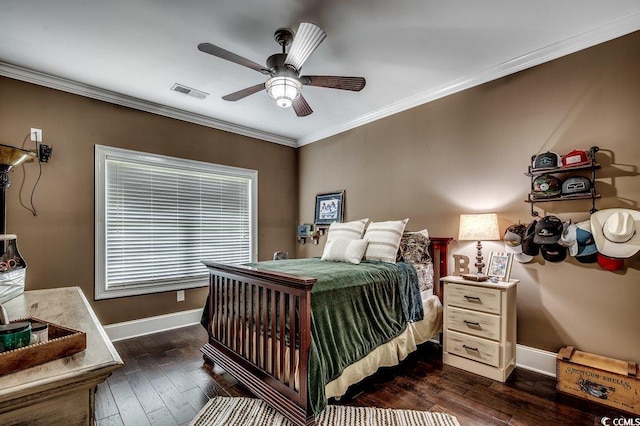 bedroom with ornamental molding, baseboards, dark wood-type flooring, and a ceiling fan