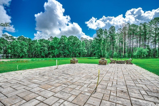 view of patio featuring a fire pit