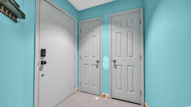 foyer entrance with light carpet