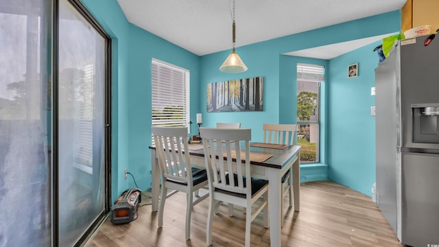 dining area featuring light wood-type flooring