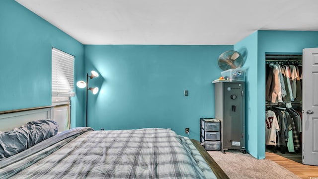 bedroom featuring a closet and wood finished floors