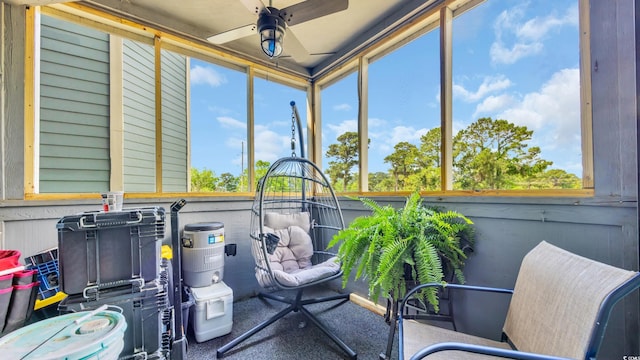 sunroom with a ceiling fan