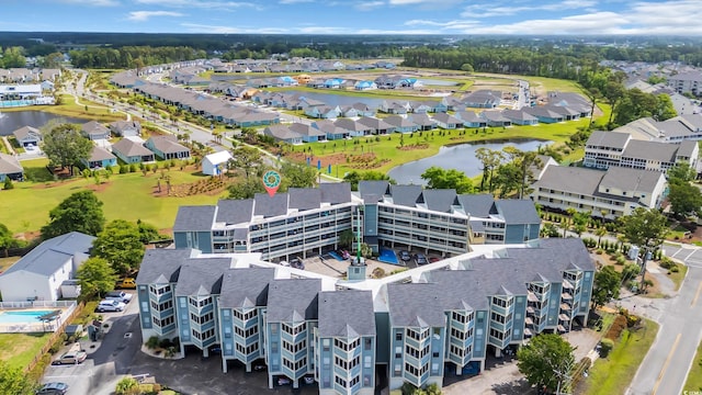 aerial perspective of suburban area featuring a nearby body of water