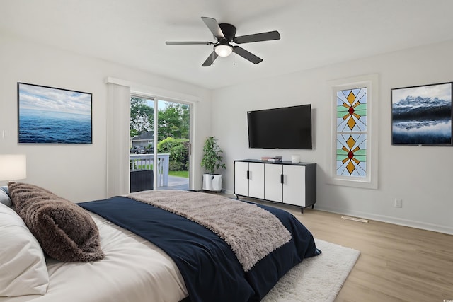 bedroom with access to exterior, light wood finished floors, baseboards, and ceiling fan
