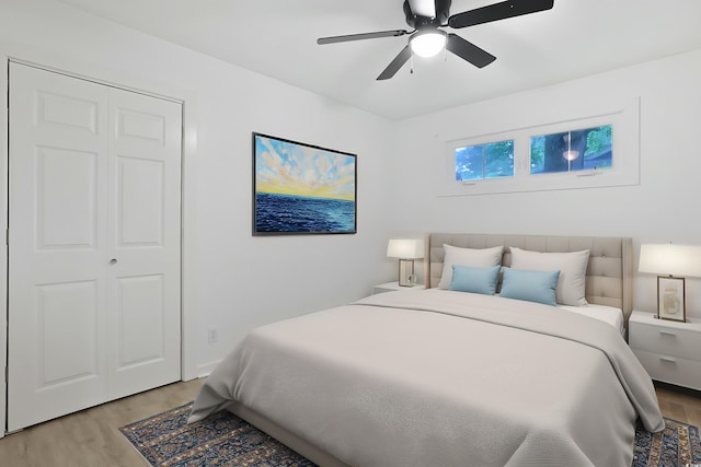bedroom with light wood finished floors and ceiling fan