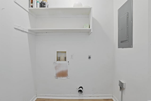 laundry area featuring electric panel, hookup for a washing machine, hookup for an electric dryer, wood finished floors, and baseboards