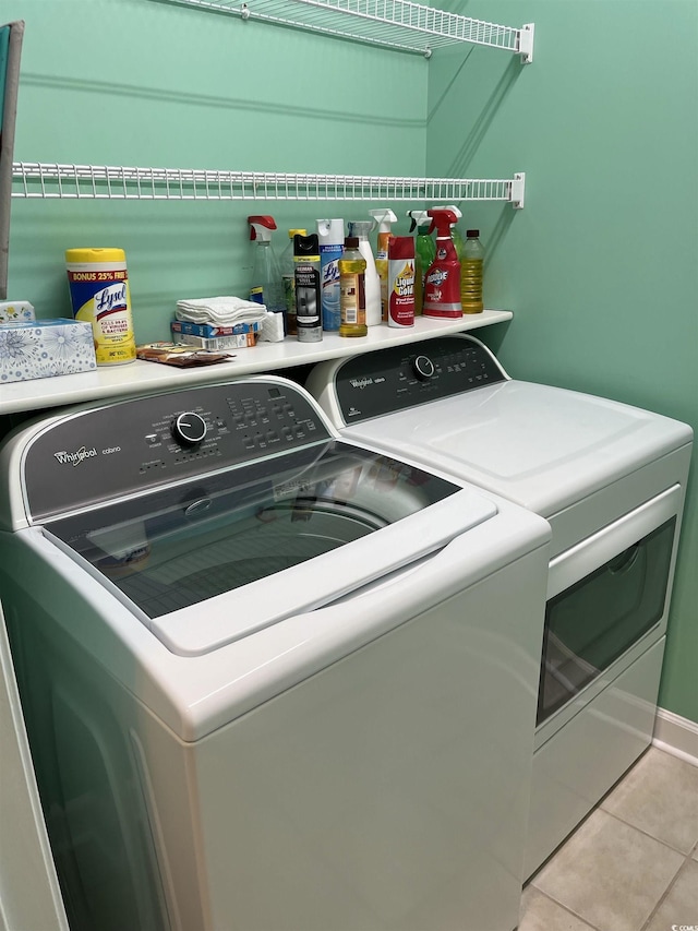 3012 Winding River Rd, North Myrtle Beach, SC 29582 - laundry area with independent washer and dryer, light tile patterned floors, and baseboards