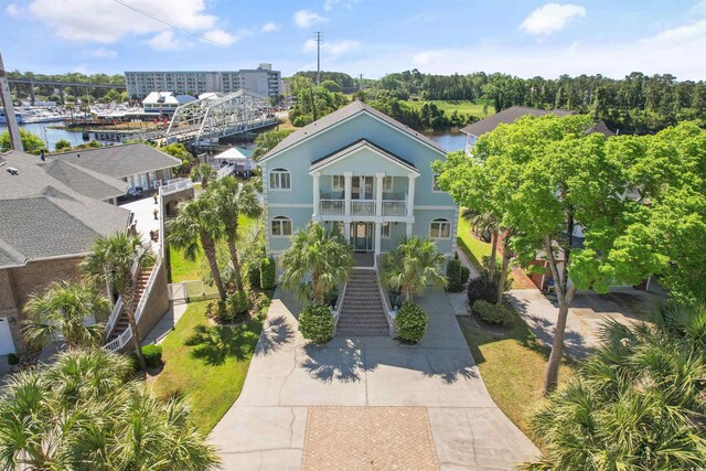 107 Waterway Crossing Ct, Little River, SC 29566 - view of front of house with a balcony, stairway, and driveway