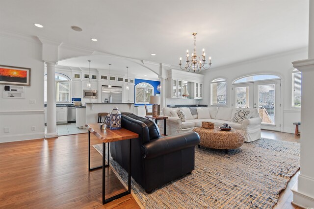 107 Waterway Crossing Ct, Little River, SC 29566 - living area with decorative columns, crown molding, wood finished floors, plenty of natural light, and recessed lighting