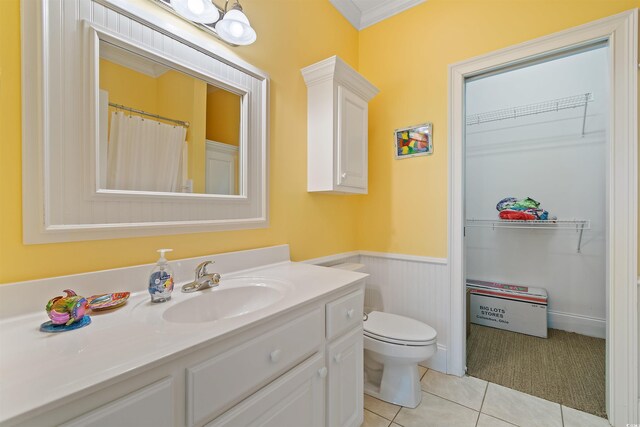 107 Waterway Crossing Ct, Little River, SC 29566 - bathroom with a wainscoted wall, vanity, tile patterned flooring, toilet, and ornamental molding