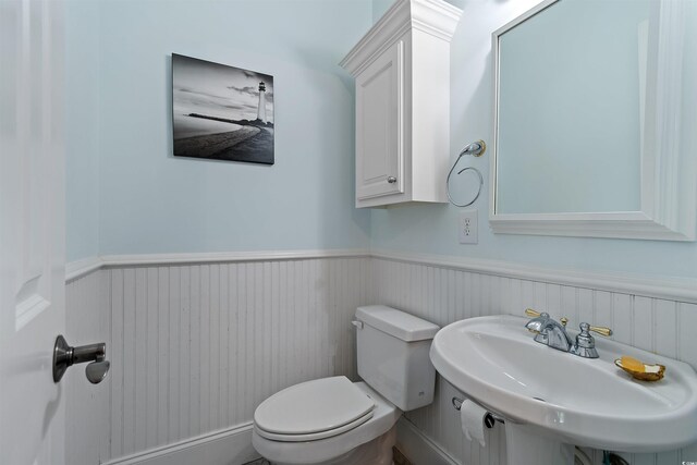 107 Waterway Crossing Ct, Little River, SC 29566 - half bathroom featuring a sink, wainscoting, and toilet