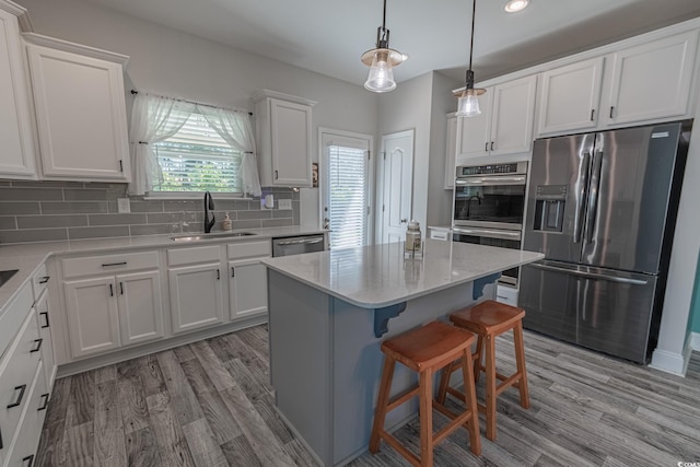 395 Dunbarton Ln, Conway, SC 29526 - kitchen with stainless steel appliances, a sink, white cabinets, tasteful backsplash, and recessed lighting