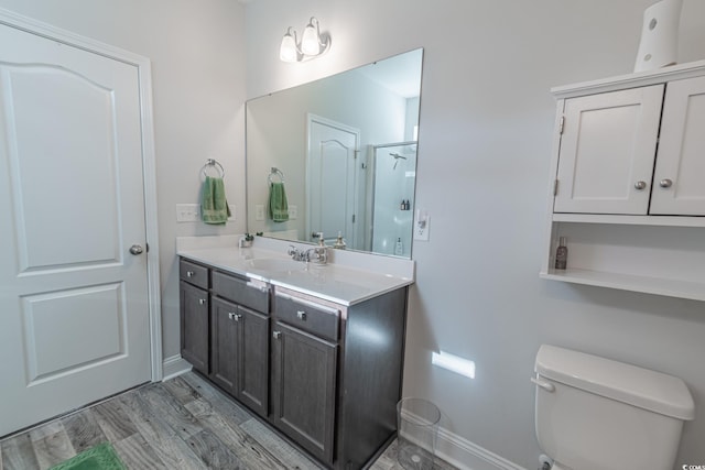 395 Dunbarton Ln, Conway, SC 29526 - bathroom featuring baseboards, vanity, toilet, and wood finished floors