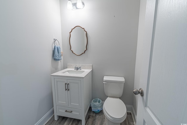 395 Dunbarton Ln, Conway, SC 29526 - bathroom featuring toilet, wood finished floors, vanity, and baseboards