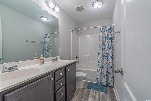 395 Dunbarton Ln, Conway, SC 29526 - full bathroom featuring shower / bath combo, double vanity, wood finished floors, and toilet