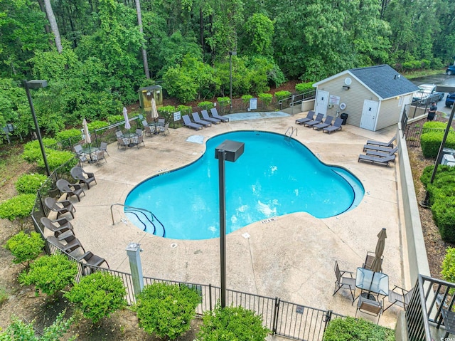 395 Dunbarton Ln, Conway, SC 29526 - community pool with fence, a patio area, and an outdoor structure