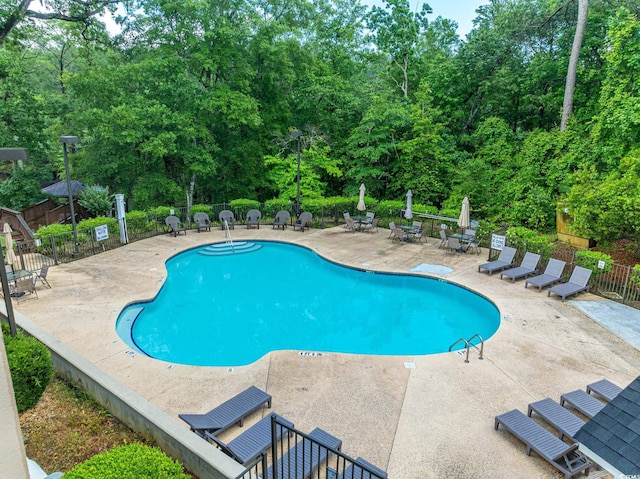395 Dunbarton Ln, Conway, SC 29526 - community pool featuring a patio and fence