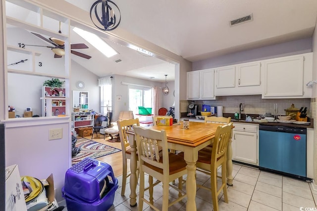 9664 Middleton Ct, Murrells Inlet, SC 29576 - kitchen featuring dishwasher, a ceiling fan, white cabinets, decorative backsplash, and vaulted ceiling