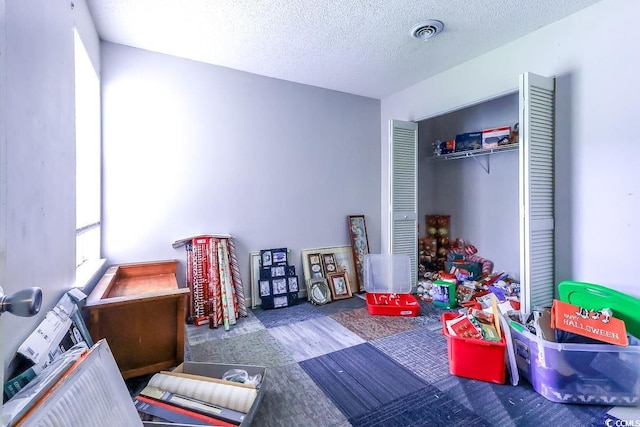 9664 Middleton Ct, Murrells Inlet, SC 29576 - game room with a textured ceiling and wood finished floors