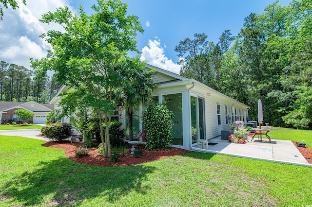111 Rose Water Loop, Myrtle Beach, SC 29588 - view of green lawn featuring a patio and a sunroom